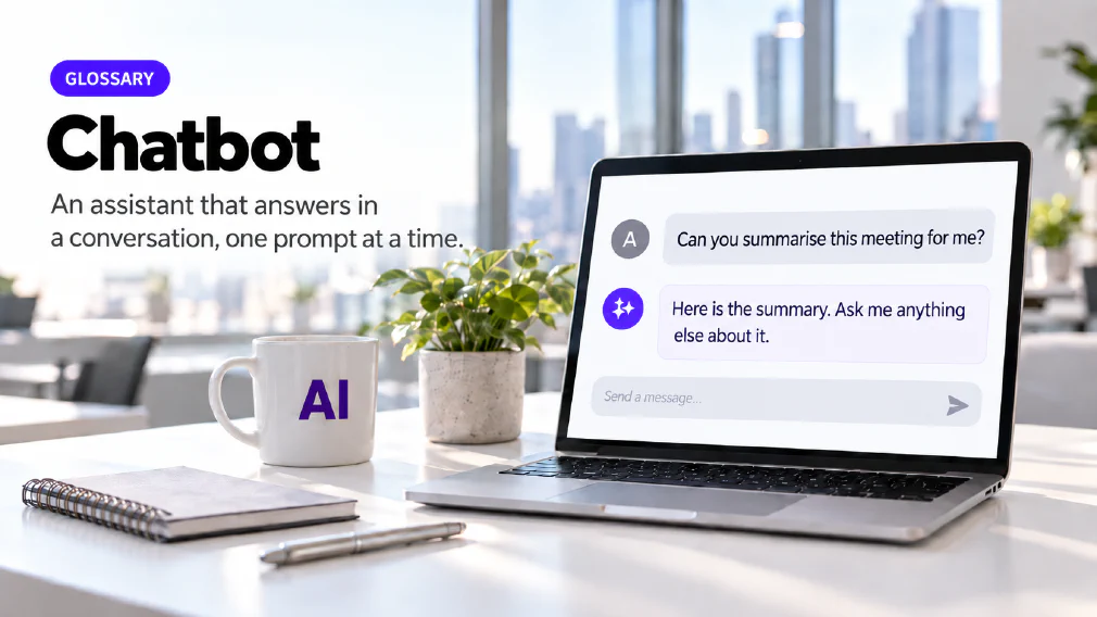 A laptop on a sunlit office desk showing a chat interface where the question "Can you summarise this meeting for me?" is answered with "Here is the summary. Ask me anything else about it." above a message box, beside a mug printed with AI, a plant, a notebook and a pen, under a GLOSSARY badge, the heading Chatbot and the subtitle An assistant that answers in a conversation, one prompt at a time.